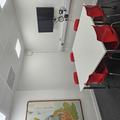 A photograph of meeting room 1. There is a white table in the centre of the room with 6 red chairs around it and a TV screen on the wall behind it. A geological map is on the far wall.