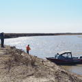 Two people on the bank of the Mackenzie Delta, June 2024
