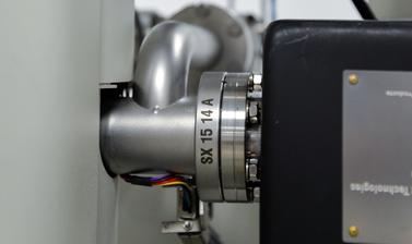 Two nozzles connected to the electron beam of the CAMECA SX-5 FE in the E-Beam Suite in the Earth Sciences Department.