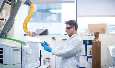 Photograph of a researcher working in the ICP-MS lab