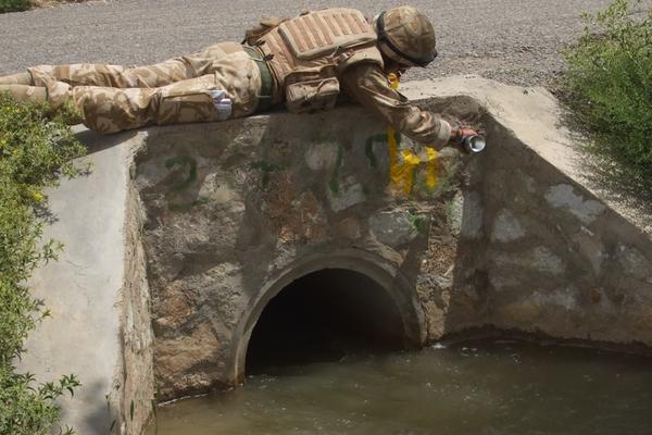 Adam Morley tagging a culvert (drainage channel) in Helmand Province