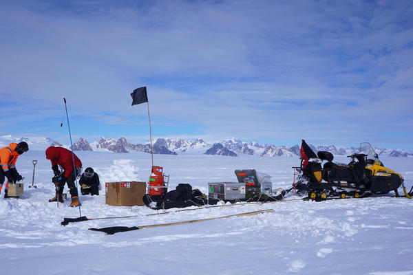 Photograph of the field team installing science instruments on the George VI Ice Shelf
