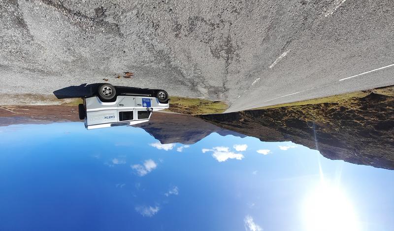 Landrover on the Assynt Field Class Photograph of the department landrover on the Assynt Field Class. The landrover is parked on a road overlooking a beautiful view with blue skies