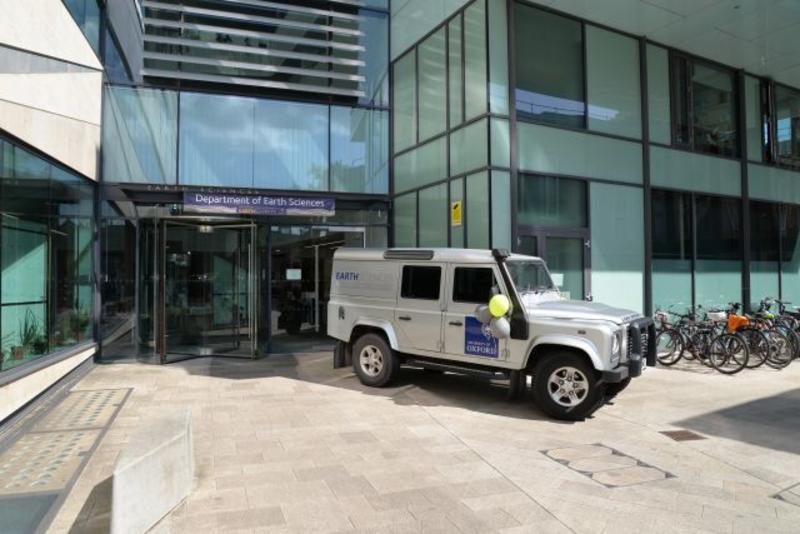Photograph of the department's Land Rover parked outside the entrance during an open day