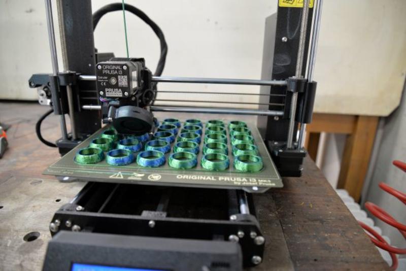 3D Printer printing blue globe shapes