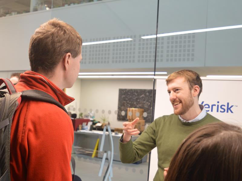 Careers Fair Photograph of an alumnus speaking to an undergraduate at the careers fair.