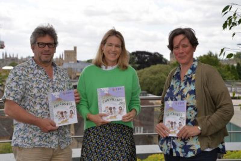 David, Martha, and Tamsin, standing on the roof terrace of the Earth Science department holding copies of the book
