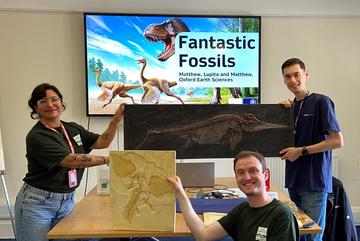 Three demonstrators from the Department of Earth Sciences displaying the Fantastic Fossils activity at the MPLS Primary Science Day