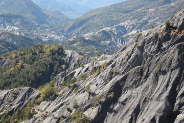 Landscape of grey shale rocks in a mountainous area