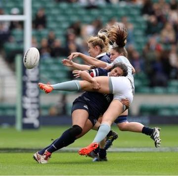 Sophie Shams Rugby Photograph of blues player Sophie tackling a Cambridge player, with the ball flying away from her