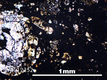 Thin Section of LAR12252 Meteorite Thin section photo of sample LAR 12252 in plane-polarised light with 5x magnification. Credit: NASA