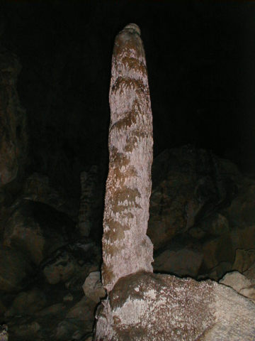 Large HS4 stalagmite in a dark cave