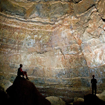 Chris Day performing fieldwork in a large cave