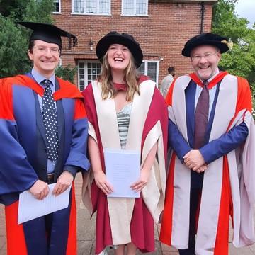 Isabel Smith at her PhD graduation with Paul Williams and Giles Harrison