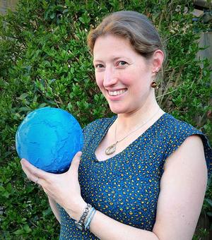 Prof Paula Koelemeijer with a 3D printed Earth